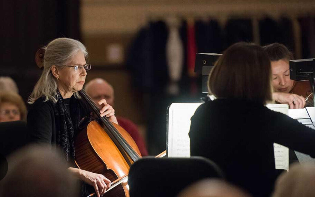A group of guitars on top of a sheet of music